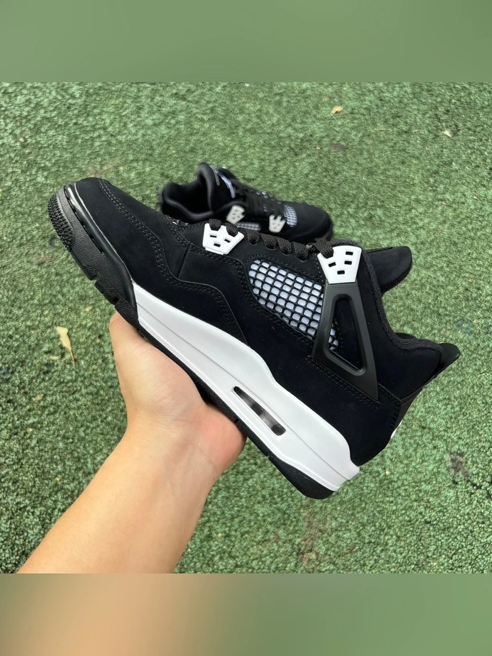 Air Jordan 4 Black and White Men's Retro Athletic Sneaker